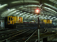 A maintenance train along the yard tracks south of the station