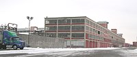 Large building that is part of the Ford plant complex (now the Highland Park Industrial Center)