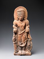 A statue of Vishnu Caturanana ("Four-Armed"), using the attributes of Vāsudeva, with the addition of an aureole around the head (5th century CE)[66]