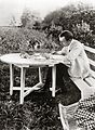 Sergei Rachmaninoff at Ivanovka, proofing his third piano concerto.
