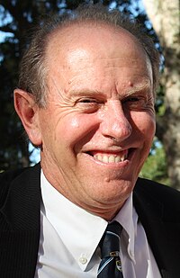 Headshot of David Coltart in a suit.