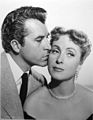Fernando Lamas and Danielle Darrieux, Lamas has a pompador with a quiff and side-burns, Darrieuux has bangs. 1951