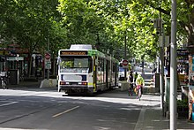 Cyclists and a tram on Swanston Street in Melbourne