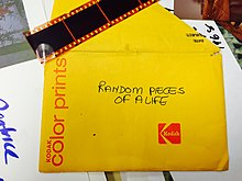Mixed items found in an archival collection at work, with the words "Random pieces of a life" written on a Kodak envelope
