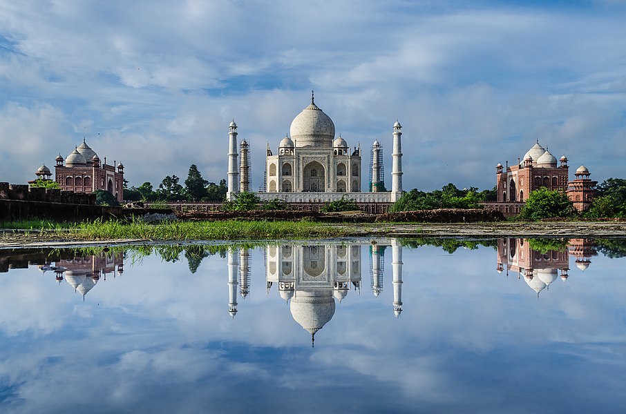 India: The Taj Mahal is an ivory-white marble mausoleum on the south bank of the Yamuna river in the Indian city of Agra. It was commissioned in 1632 by the Mughal emperor Shah Jahan (reigned 1628–1658) to house the tomb of his favourite wife, Mumtaz Mahal. The tomb is the centrepiece of a 17-hectare (42-acre) complex, which includes a mosque and a guest house, and is set in formal gardens bounded on three sides by a crenellated wall.
