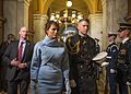 Melania Trump is escorted by a White House social aide at the United States Capitol in 2017