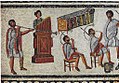 Image 8Musicians playing a Roman tuba, a water organ (hydraulis), and a pair of cornua, detail from the Zliten mosaic, 2nd century AD (from Culture of ancient Rome)