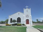 The First Baptist Church was built in 1938 and is located at 218 E. 8th St. It was listed in the National Register of Historic Places in 2002, reference #02000751.