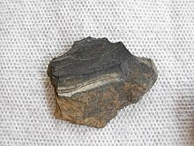 dark rock with a stripe of lighter material