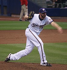 A baseball player in white
