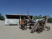 Saguaro Ranch Farm machinery and 1890s Horse Stable (in background).