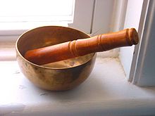 An image of a sound bowl with a wooden striker