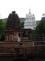 Mahakuteshvara temple (painted white) in the dravida style (rear) and Sangameshvara temple in nagara style (front)