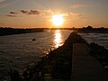 Image 42The Jersey Shore extends inland from the Atlantic Ocean into its many inlets, including Manasquan Inlet, looking westward at sunset from the jetty at Manasquan. (from New Jersey)