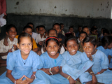 2. Radiant school-children, every last one smiling.