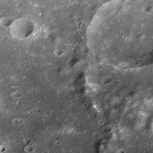 Hollows on mountain within Steichen crater
