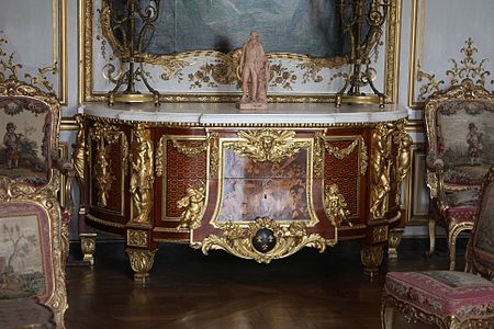 Louis XVI style altantes on a commode, by Jean-Henri Riesener, 1775, gilt brone, marble top, and various types of wood, Musée Condé, Chantilly, France[11]