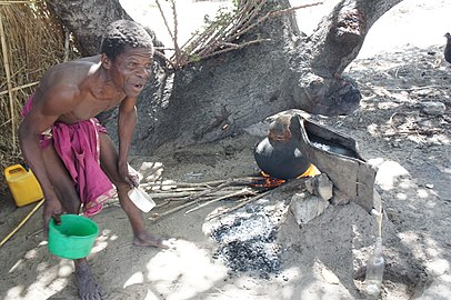 Distilling cashew apple liquor (muchekele) in Mozambique, southeastern Africa