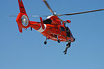 HH-65 Dolphin demonstrating hoist rescue capability