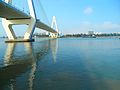 Mouth of the Haidian River entering Haikou Bay, with Haikou Century Bridge on the left, and Haidian Island on the opposite shore.