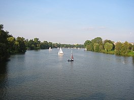 A lake with sailing boats upon it