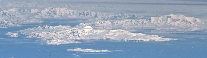 Brabant Island seen from northeast, with Mount Parry in its central part, and Anvers Island (on the right) and Antarctic Peninsula in the background.