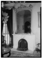 Fireplace with firebox and mirror above