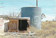 Tank behind the abandoned Twin Arrows Trading Post.