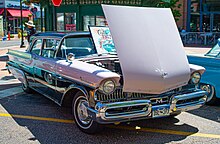 1957 Mercury in Sunset Orchid and Black two-tone