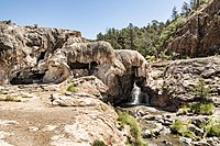 A small waterfall coming from a large mineral deposit