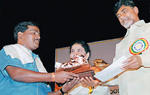 B. Venkateshwarlu (left) receiving Nandi Award from the then Chief Minister of Andhra Pradesh, Mr. N. Chandrababu Naidu (right)