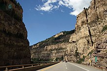 A railroad, river and two-tiered highway following a narrow canyon