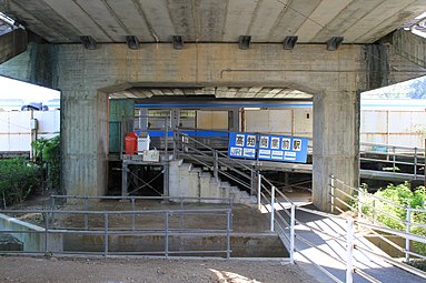 View of the station entrance under the road viaduct in 2011