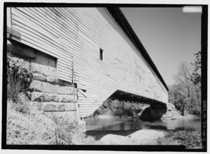 Exterior view of Northeast side of bridge from South bank of Sugar Creek; Cornerstone visible in South abutment