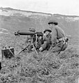 Soldiers of Princess Patricia's Canadian Light Infantry firing a Vickers machine gun during a training exercise, Eastbourne, England, December 3, 1942
