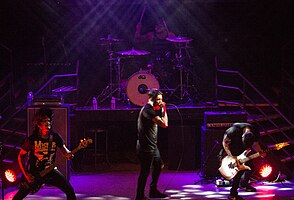 Dead Rabbitts performing live in 2014. From left to right: TJ Bell, Rob Pierce (above), Craig Mabbitt (below) and Alex Torres.