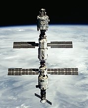 The Progress M1-3 seen docked at the bottom of the Zvezda module of the ISS during STS-106.