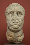 Damaged head of Vitellius in the Ny Carlsberg Glyptotek, Denmark. The damage is the result of damnatio memoriae.[56][53][54][55]