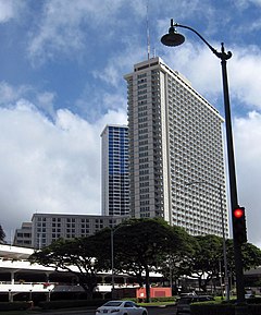 The Ala Moana Hotel, a high-rise building topped by a red-and-white antenna spire