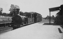 A steam train at a platform in 1926.