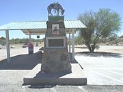 Tom Mix Monument. Location where Tom Mix, a megastar of the silent film industry, died in 1940. The inscription reads as follows: “Jan. 6, 1880 – Oct. 12, 1940. In Memory of Tom Mix whose spirit left his body on this spot, and whose characterization and portrayals in life served to better fix memories of the Old West in the minds of living men” The monument is located in Arizona highway 79 about 20 miles from Florence, Az.