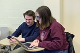 Editors confer during the Cornell University 2017 Art + Feminism Wikipedia edit-a-thon. Olin Library, March 11, 2017.