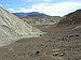 Wide, rocky sandy canyon with path