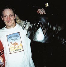 Mike Derks, out of costume, holding the Balsac head in 2002