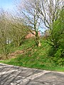 The remains of the wooden pedestrian footbridge and way up to Lugton High station.