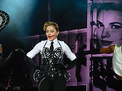 Madonna on the MDNA Tour, the most recent of her three that achieved highest-grossing tour of the year