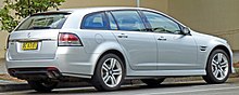 Rear three-quarters view of a silver station wagon car