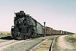 Santa Fe Railroad 2-10-4 locomotive #5000 "Madame Queen" pulling a freight train in New Mexico