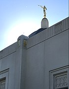 Angel Moroni toots his trumpet at Venus with 666 above a window