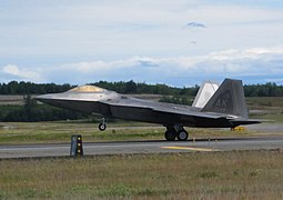 An F-22 Raptor landing at Elmendorf AFB, demonstrating aerodynamic braking.